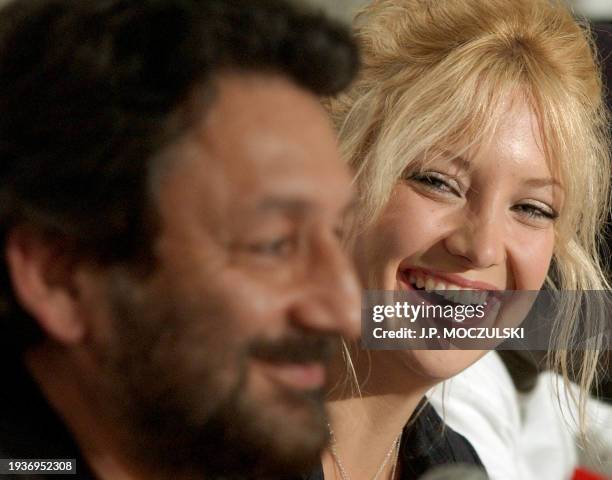 Indian director Shekhar Kapur laughs with US actress Kate Hudson while discussing the making of his new film "The Four Feathers" during a news...