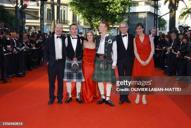 British director Ken Loach poses for photographers with producer Rebecca O'Brien , actors William Ruane , Annmarie Fulton , Martin Compston and...