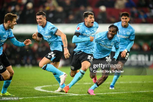 Granit Xhaka, Exequiel Palacios, Jeremie Frimpong and Piero Hincapie celebrating their teams winning goal during the Bundesliga match between FC...