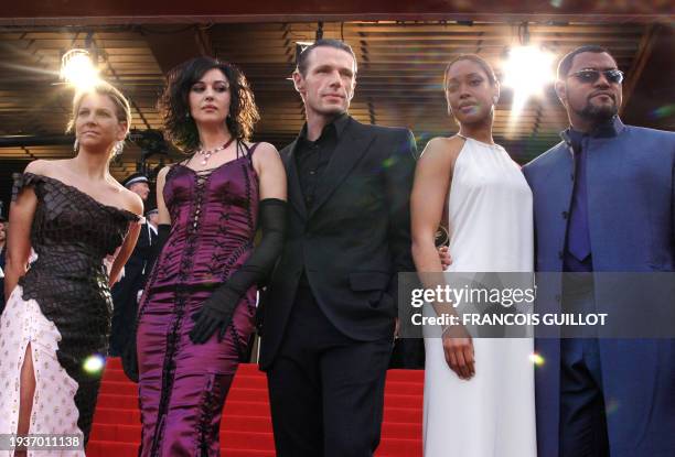 Italian actress Monica Bellucci , French actor Lambert Wilson and US actor Lawrence Fishburne pose with others unidentified persons on the steps of...