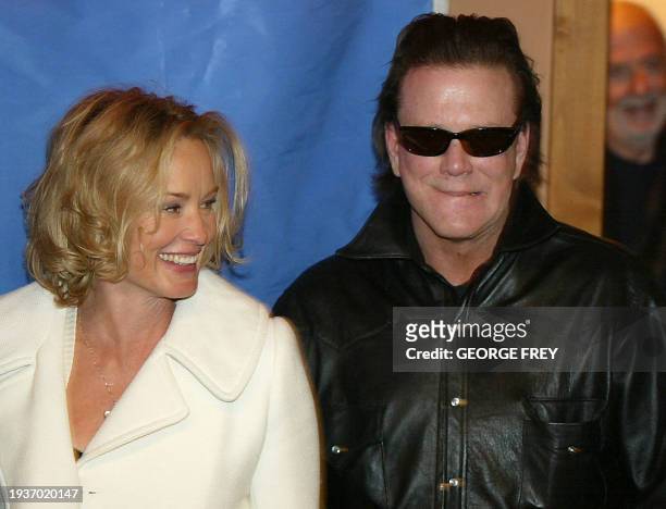 Actors Jessica Lange and Mickey Rourke pose for photos before the premiere of "Masked and Anonymous" at the 2003 Sundance Film Festival in Park City,...