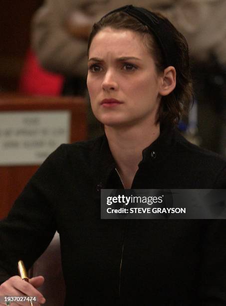 Actress Winona Ryder listens as she is sentenced to 3 years probation, 480 hours of community service and $11,300 in fines and restitution, in...
