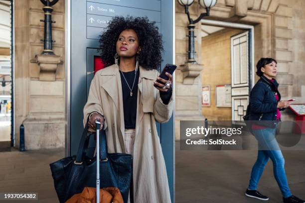 a fashionable woman in the city - spring arrival stock pictures, royalty-free photos & images