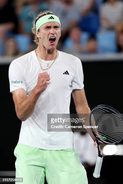 Alexander Zverev of Germany celebrates winning set point in their round one singles match against Dominik Koepfer of Germany during the 2024...