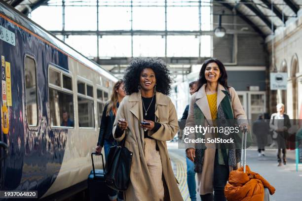 the weekend has begun - train arrival stock pictures, royalty-free photos & images