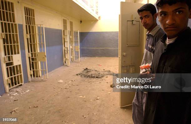 Iraqis inspect empty cells April 17, 2003 inside the Abu Ghraib Prison, 10 km. West of Baghdad, Iraq. After years of rumors of atrocities said to...