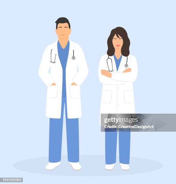 volle länge des jungen männlichen arztes, der mit den händen in den taschen und und junger ärztin steht mit verschränkten armen. konzept des nationalen ärztetages - laborkittel stock-grafiken, -clipart, -cartoons und -symbole