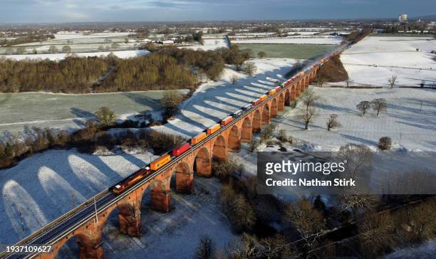 Train crosses the Twemlow Viaduct on January 16, 2024 in Holmes Chapel, United Kingdom. The UK is in the grip of a cold spell, with Arctic air...