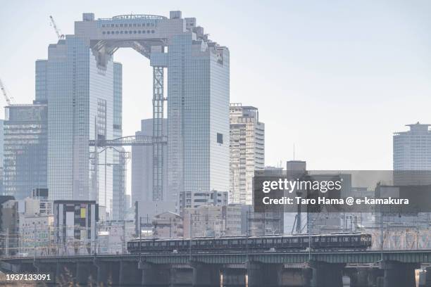 railroad and city building in osaka city of japan - umeda sky building foto e immagini stock