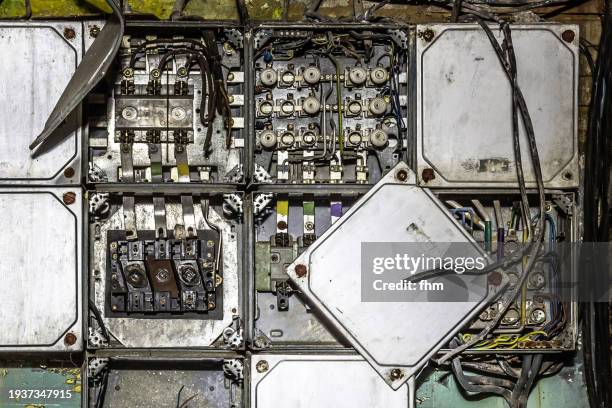 old rusty fuse box of an electrical system in an abandoned building - electrical panel box stock pictures, royalty-free photos & images