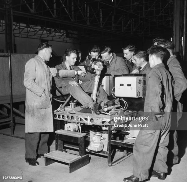 Class of boy entrants are instructed by Corporal HC Charles on the automatic pilot apparatus at the School of Technical Training at RAF Cosford, a...