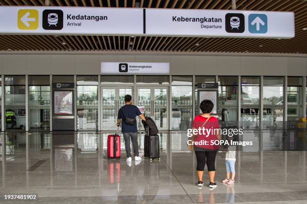 Passengers walk towards a high-speed train at Tegalluar High Speed Train Station. Since its commencement on October 17 the Jakarta-Bandung High-Speed...