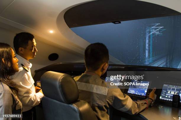 China Indonesia High-Speed Train instructor instructs Electric Multiple Unit train engineer trainees while trying the Tegalluar High-Speed Train...