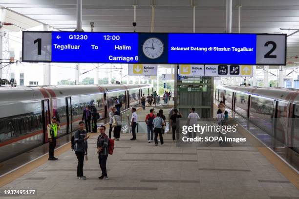 Passengers walk towards a high-speed train at Tegalluar High Speed Train Station. Since its commencement on October 17 the Jakarta-Bandung High-Speed...
