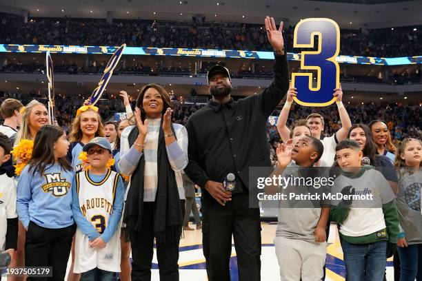 Former NBA and Marquette Golden Eagles player Dwyane Wade speaks to the crowd during the first half of the game between the Villanova Wildcats and...