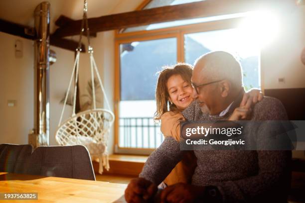 grandfather and grandson share a moment - house golden hour stock pictures, royalty-free photos & images