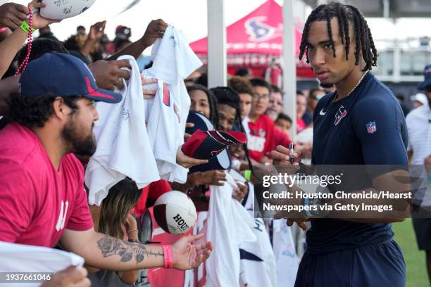 Houston Texans quarterback C.J. Stroud signs autographs at the end of practice during an NFL training camp Friday, July 28 in Houston.