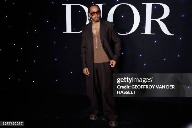 British Formula One driver Lewis Hamilton attends the Dior Homme Menswear Ready-to-wear Fall-Winter 2024/2025 collection as part of the Paris Fashion...