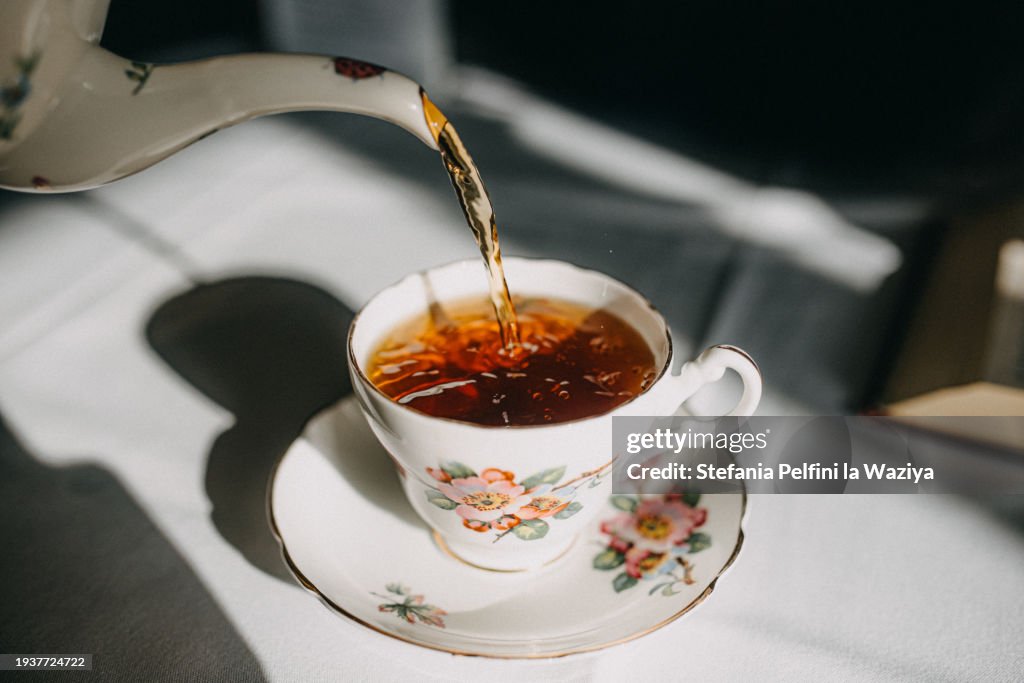 Vintage China Pouring Tea In Tea Pot