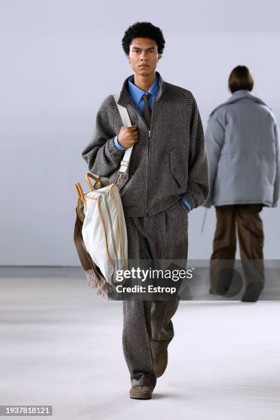 Model walks the runway during the Auralee Menswear Fall/Winter 2024-2025 show as part of Paris Fashion Week on January 16, 2024 in Paris, France.