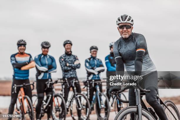 a dutch cycling racing team posing for a team photo - cyclist stock pictures, royalty-free photos & images