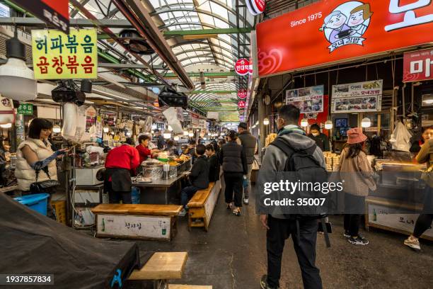 kwangjang food market in seoul - basil sellers stock pictures, royalty-free photos & images