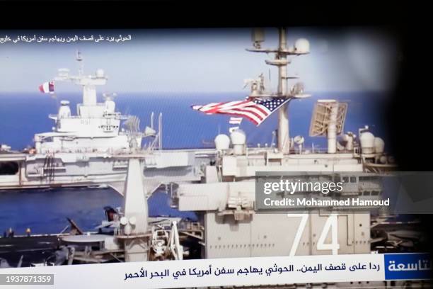 Yemeni man browsing the news on his laptop screen that broadcasts U.S.-U.K. Warships amid news spread relating to the attack on the Zografia ship in...