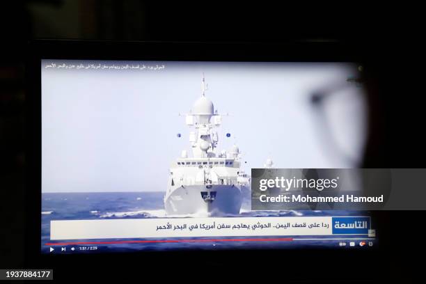 Yemeni man browsing the news on his laptop screen that broadcasts U.S.-U.K. Warships amid news spread relating to the attack on the Zografia ship in...