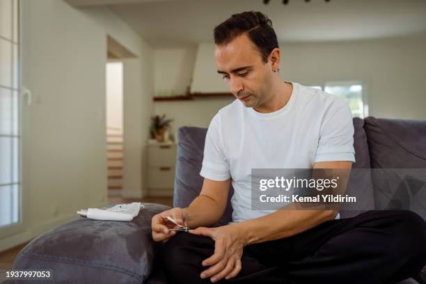 young woman making manicure at home - black gay muscle men stock pictures, royalty-free photos & images