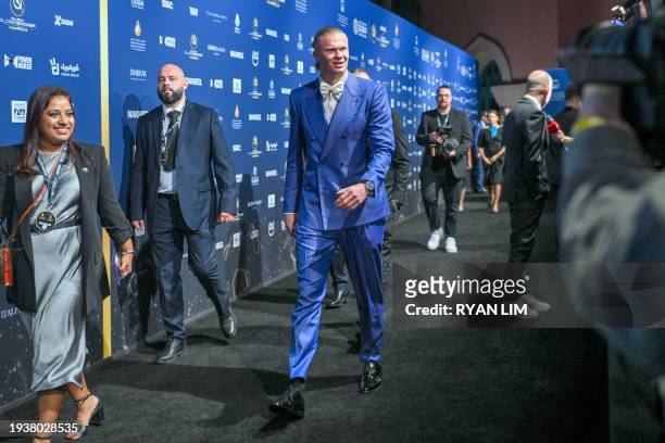 Manchester City's Norwegian forward Erling Haaland arrives to attend the 14th edition of the Globe Soccer Awards in the Gulf Emirate of Dubai on...