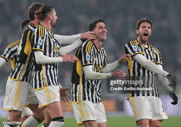Dusan Vlahovic of Juventus celebrates with Manuel Locatelli and teammates after scoring the team's second goal during the Serie A TIM match between...
