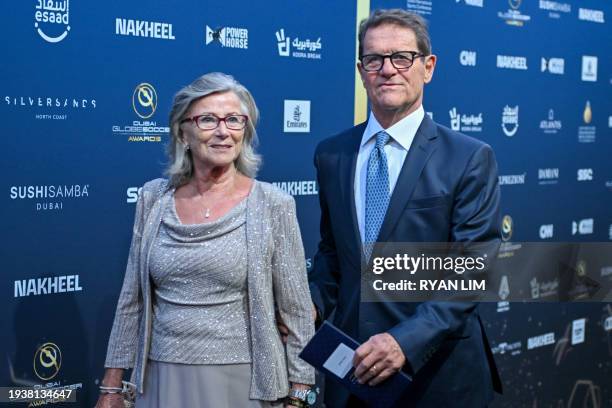 Italian former football player and coach Fabio Capello and his wife, Laura Ghisi, arrive to attend the 14th edition of the Globe Soccer Awards in the...