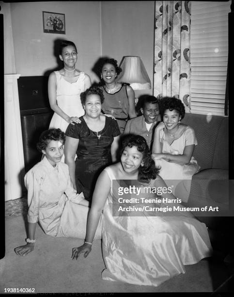 Portrait of a group of women, including Delta Sigma Theta sorority pledges Carrie Warley and Dorothy Pridgen , as they pose in Susie Boone's living...