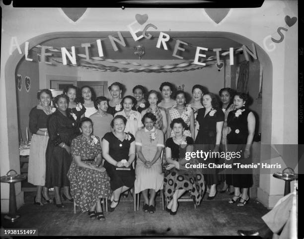 Members of JUMS Club posed in Loendi Club, Pittsburgh, Pennsylvania, February 1954. Seated from left: Marjorie Coy, Addie Trent, Betty Canty, Corrine...