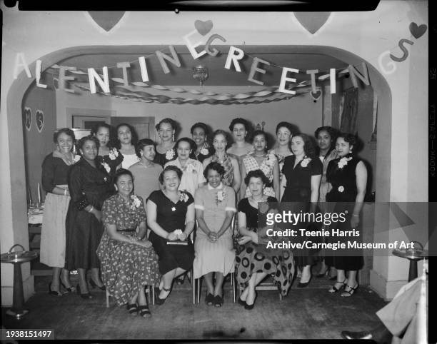 Members of JUMS Club posed in Loendi Club, Pittsburgh, Pennsylvania, February 1954. Seated from left: Marjorie Coy, Addie Trent, Betty Canty, Corrine...