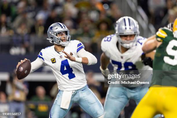 Dak Prescott of the Dallas Cowboys looks to pass during an NFL wild-card playoff football game between the Dallas Cowboys and the Green Bay Packers...