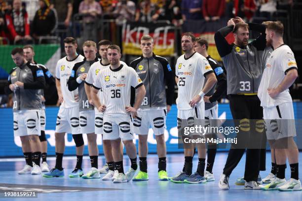 The players of Germany look dejected after the Men's EHF Euro 2024 preliminary round match between France and Germany at Mercedes-Benz Arena on...