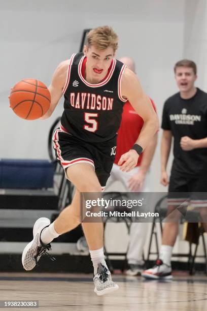 Grant Huffman of the Davidson Wildcats dribbles the ball up court during a college basketball game against the George Washington Colonials at the...