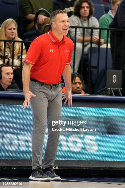 Head coach Matt McKillop of the Davidson Wildcats looks on during a college basketball game against the George Washington Colonials at the Smith...