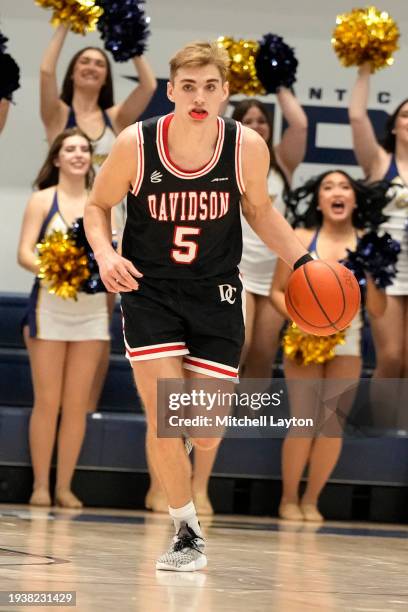 Grant Huffman of the Davidson Wildcats dribbles the ball during a college basketball game against the George Washington Colonials at the Smith Center...