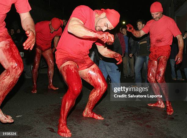 Penitents walk through the streets beating themselves with pins April 18, 2003 in a procession through the streets of Verbicaro, Southern Italy. The...