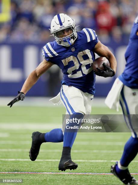 Jonathan Taylor of the Indianapolis Colts runs with the ball during the game against the Houston Texans at Lucas Oil Stadium on January 06, 2024 in...