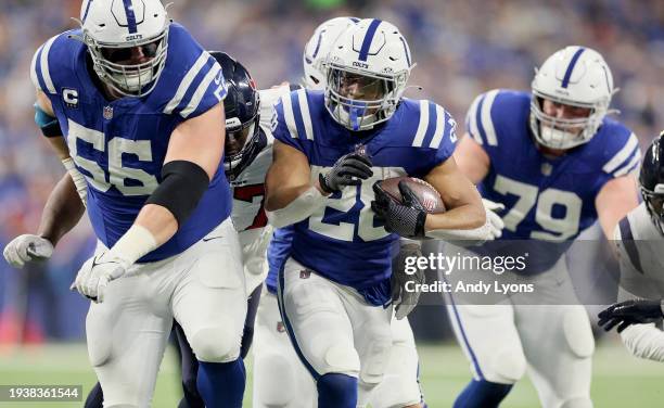 Jonathan Taylor of the Indianapolis Colts runs with the ball during the game against the Houston Texans at Lucas Oil Stadium on January 06, 2024 in...