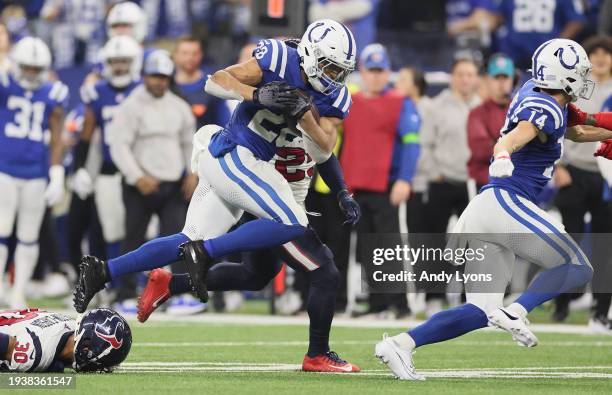 Jonathan Taylor of the Indianapolis Colts runs with the ball during the game against the Houston Texans at Lucas Oil Stadium on January 06, 2024 in...