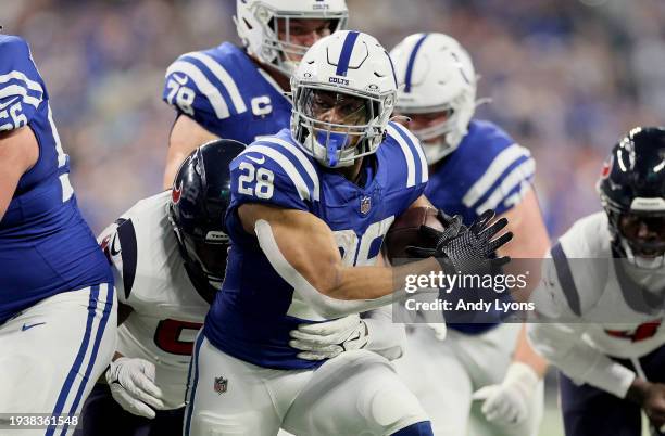Jonathan Taylor of the Indianapolis Colts runs with the ball during the game against the Houston Texans at Lucas Oil Stadium on January 06, 2024 in...