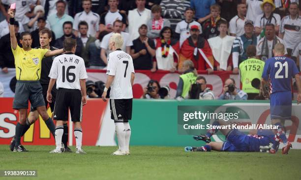 June 12: Jens Lehmann Goalkeeper of Germany looks angry when Referee Frank De Bleeckere shows Red card to send off Bastian Schweinsteiger of Germany...
