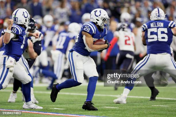 Jonathan Taylor of the Indianapolis Colts runs with the ball during the game against the Houston Texans at Lucas Oil Stadium on January 06, 2024 in...