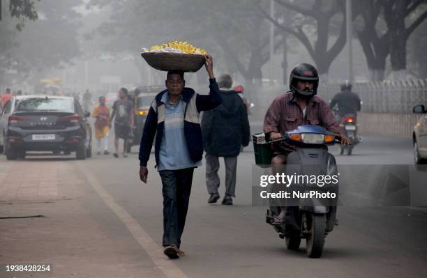 Commuters Are Seen On The Fog Engulfed Road In A Winter Morning In The Eastern Indian State Odisha's Capital City Bhubaneswar, on January 19, 2024.