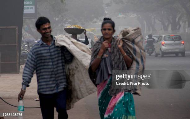 Commuters Are Seen On The Fog Engulfed Road In A Winter Morning In The Eastern Indian State Odisha's Capital City Bhubaneswar, on January 19, 2024.