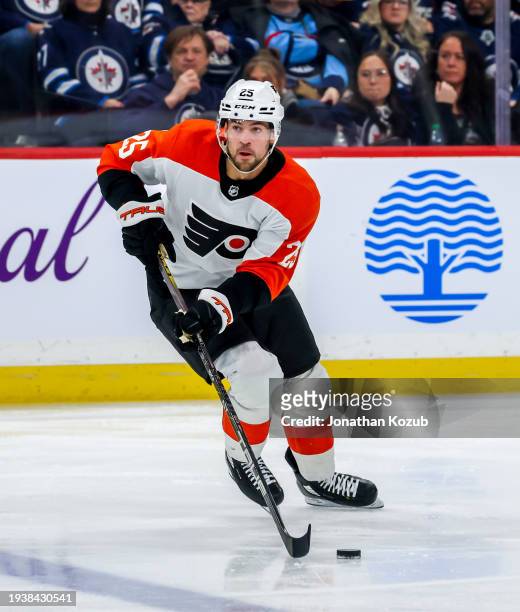 Ryan Poehling of the Philadelphia Flyers plays the puck during third period action against the Winnipeg Jets at Canada Life Centre on January 13,...